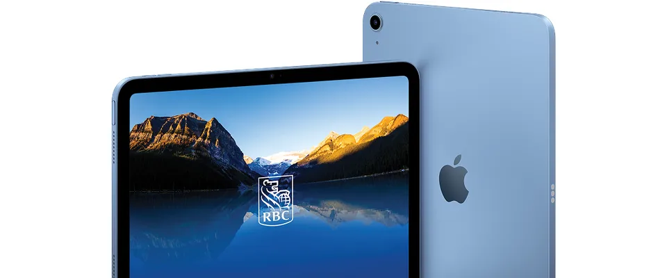 An iPad displaying a mountain lake beside the RBC shield.