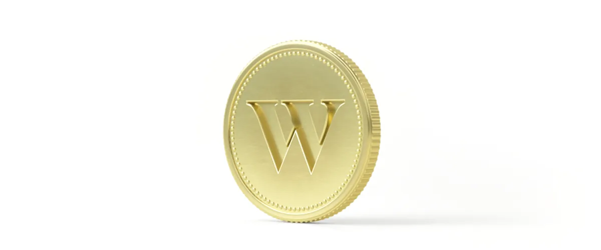 A gold Wealthsimple coin on a dark background.
